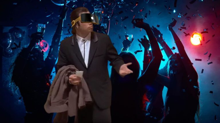 John Travolta wearing Apple VR at a party