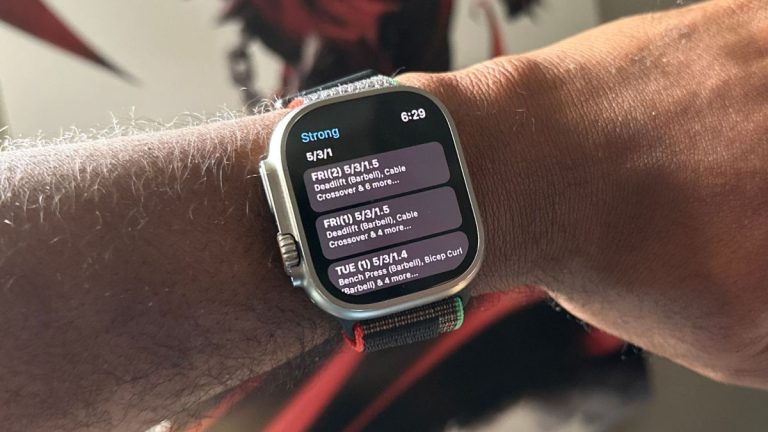 Apple Watch Ultra on arm with workout details on it